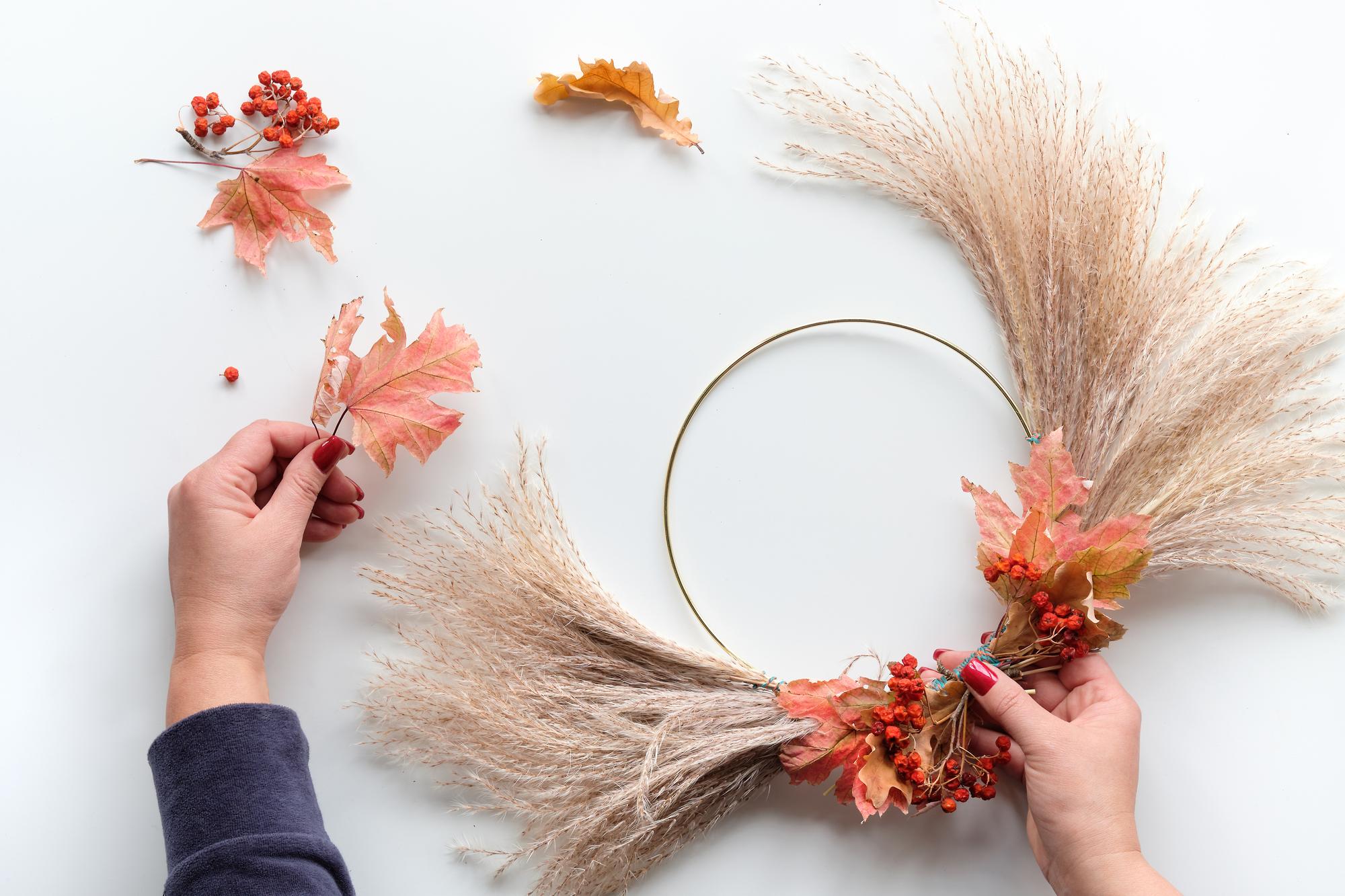 Artist hands embroidering floral motif